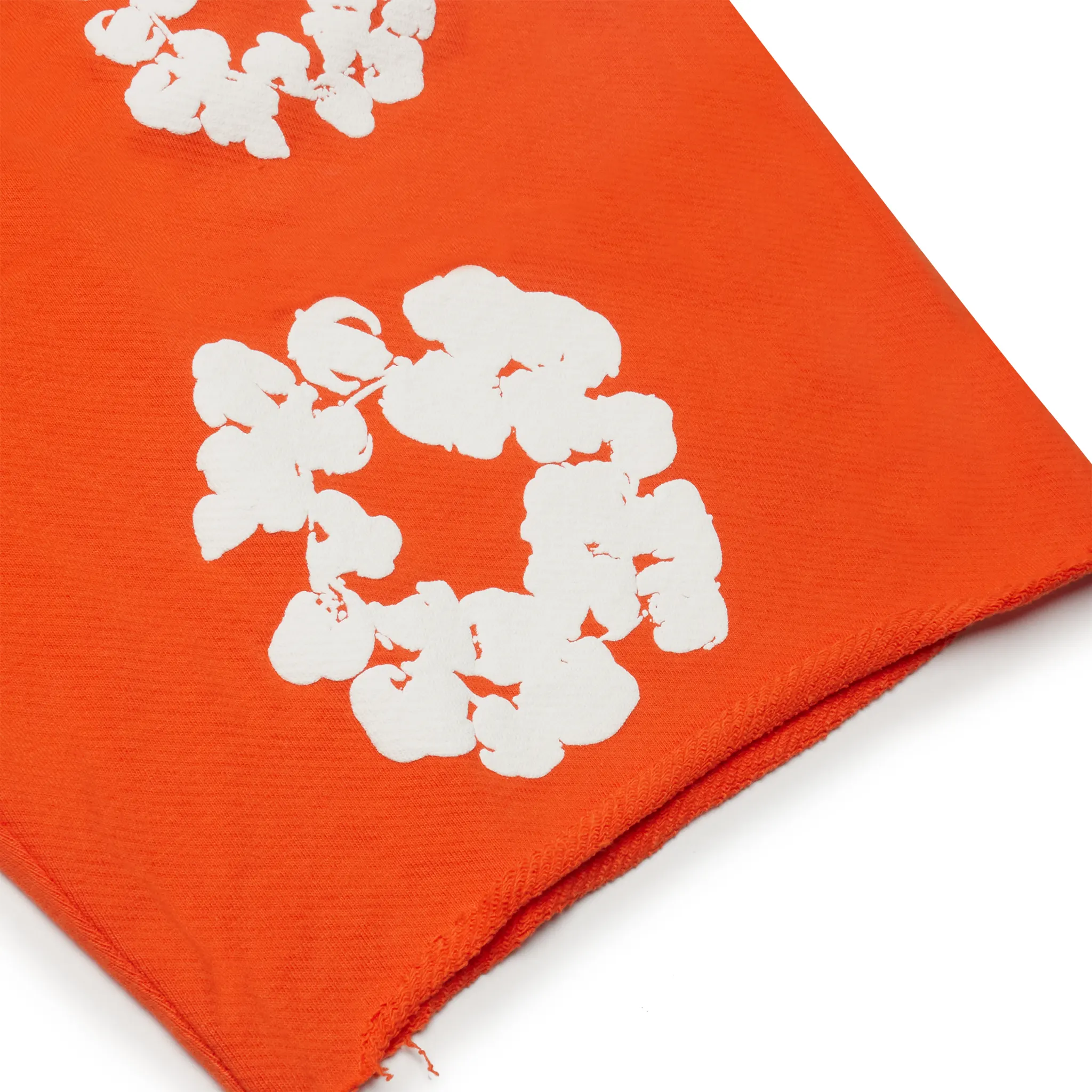 Detail view of Denim Tears The Cotton Wreath Orange Shorts